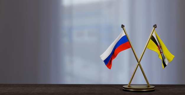 Bandiere Russia e Brunei sul tavolo Negoziazione tra Brunei e Russia su sfondo poco sfocato Lavoro 3D e immagine 3D