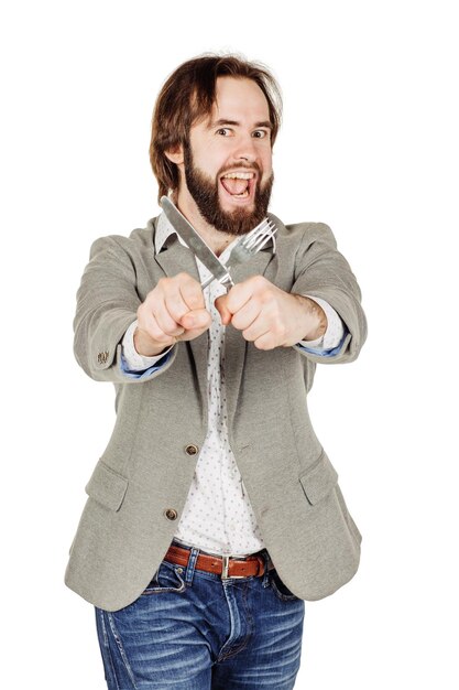 Barba uomo che tiene posate forchetta e coltello a portata di mano dieta cibo sano concetto di stile isolato su uno sfondo bianco per studio