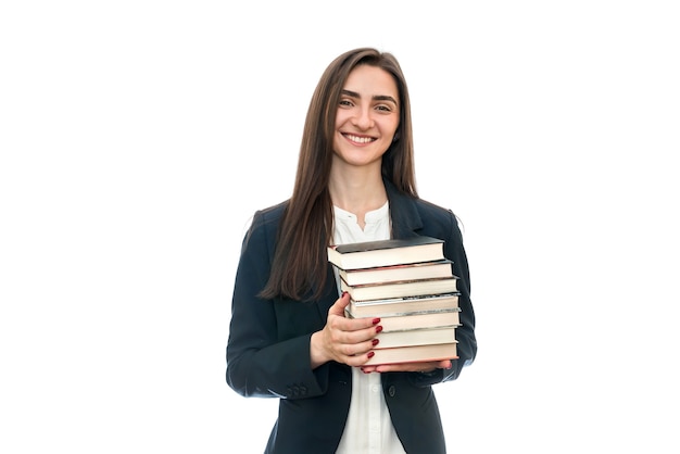 Bella giovane donna con i libri isolati