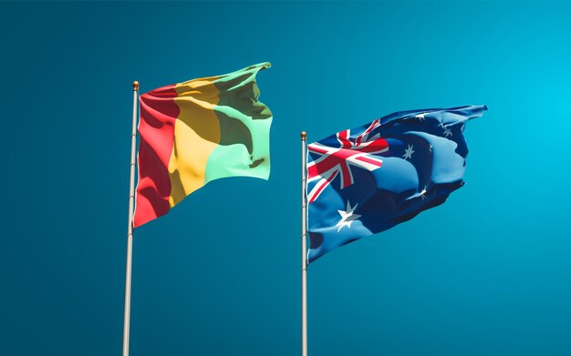 Belle bandiere nazionali dello stato della Guinea e dell'Australia insieme