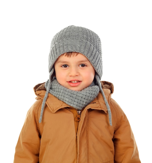 Bello bambino con sciarpa e cappotto di lana