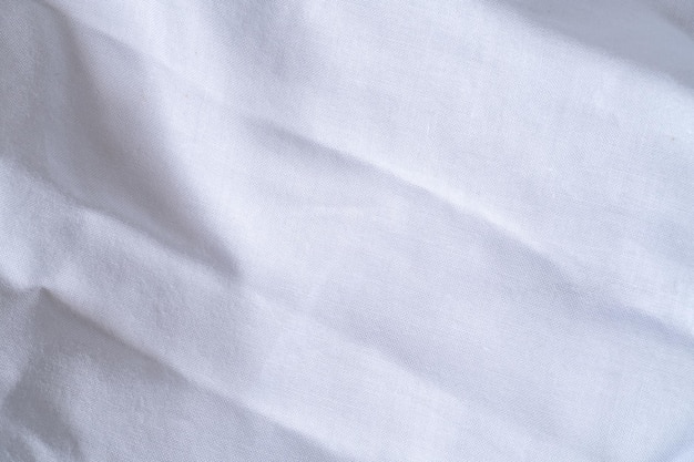 Biancheria da letto bianca struttura sfumata curva sfocata stile di tessuto astratto di lusso Biancheria da letto stropicciata e sfondo grigio scuro