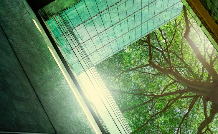 Foto bioedilizia sostenibile edificio ecologico nella città moderna edificio per uffici in vetro sostenibile