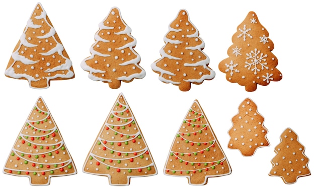 Biscotti a forma di albero con un motivo isolato Set di fiocchi di neve di biscotti allo zenzero su uno sfondo bianco