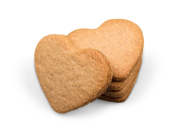 Biscotti alla cannella a forma di cuore su sfondo