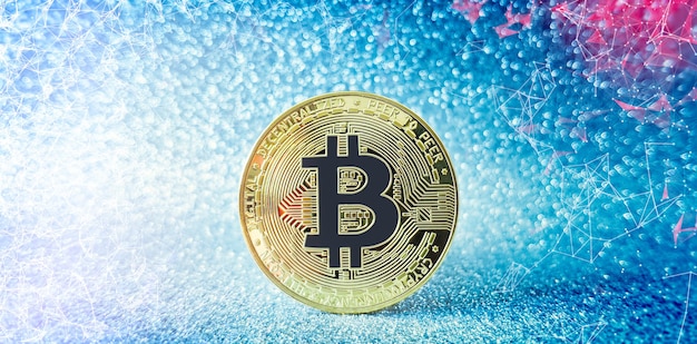 Bitcoin moneta d'oro e sfondo glitter sfocato