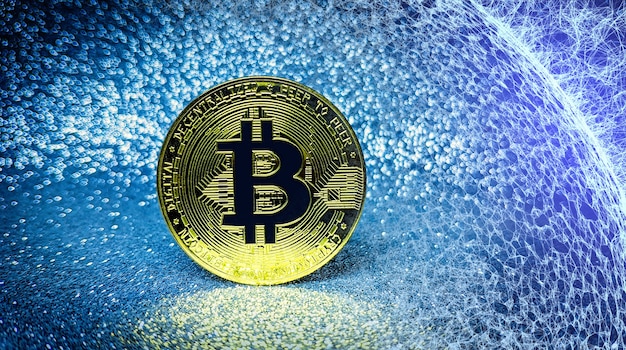 Bitcoin moneta d'oro e sfondo glitter sfocato