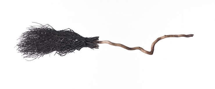 Photo black halloween witchs broom on a white background