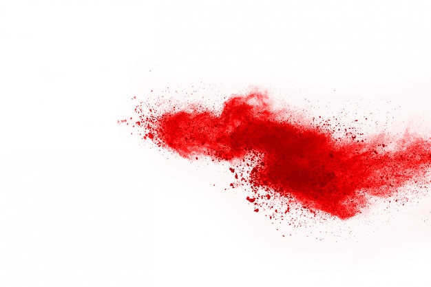 Bloccare il movimento di polvere rossa che esplode, isolato su sfondo bianco.