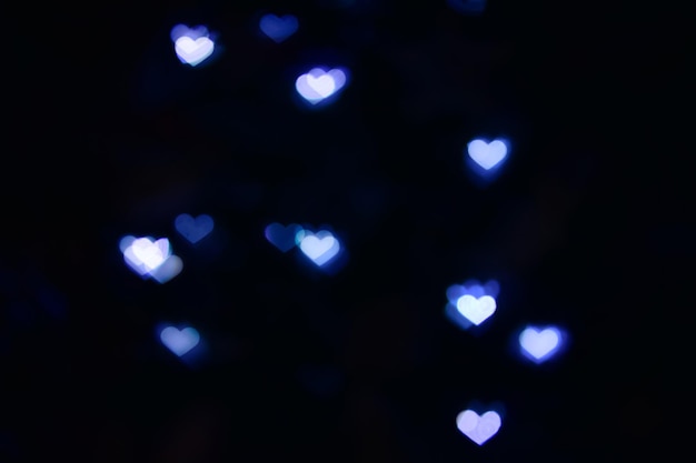 Bokeh blu a forma di cuore. Sovrapposizione. San Valentino