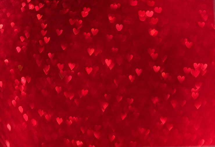 Foto bokeh cuori rossi. san valentino amore sfondo