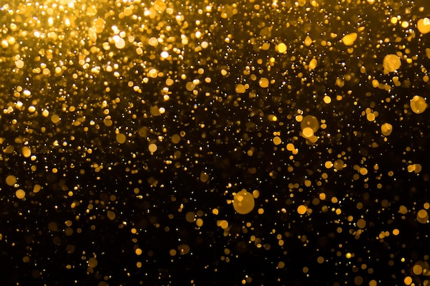 Bokeh d'oro astratto con nero