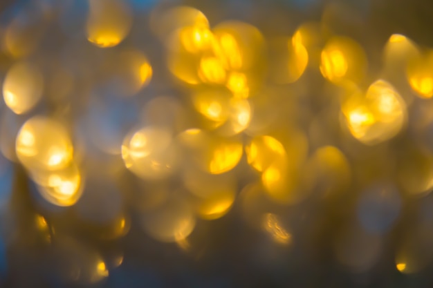 Bokeh di sfondo color oro. Elegante sfondo astratto con luci sfocati bokeh