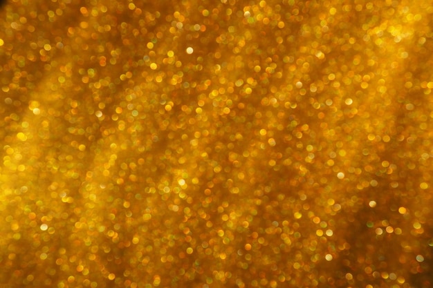 Bokeh luce d'oro luccica sfondo texture glitter dorato carta da imballaggio glitter scintillante con
