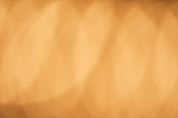 Bokeh marrone dorato disegno del fascio di colore sfondo astratto Sfocatura sovrapposizione di luce Raggi di riflesso lente Abbagliamento sfocato