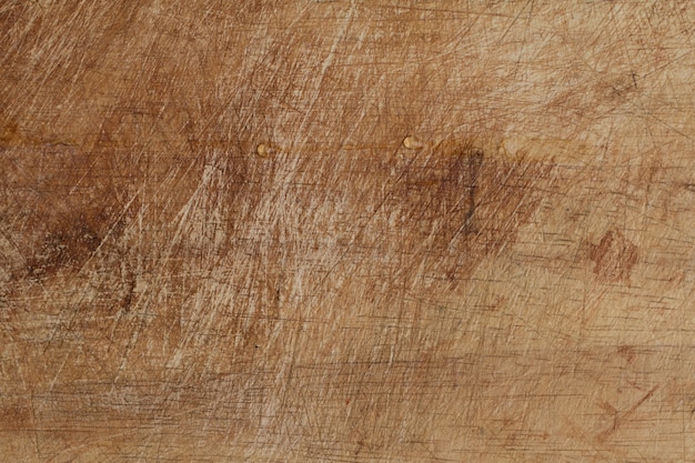 Bordo di taglio in legno grunge con copia spazio per creare sfondo di cibo