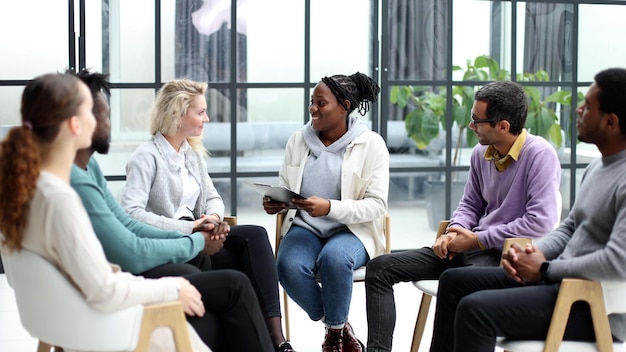 business training and coaching in the company people sit and chat