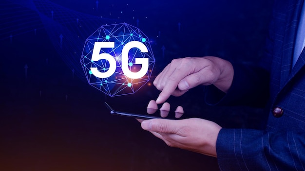 business using smartphone with holographic 5g network concept digital globe with interconnected 5g symbols 5g technology in modern business and communication digital transformation