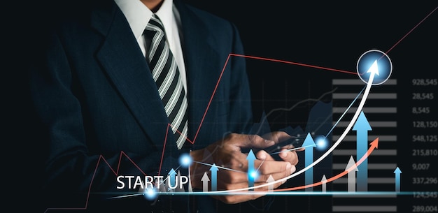 businessman analyzing business plan growth and growth of positive indicators in business digital charts on a virtual interface business planning concept