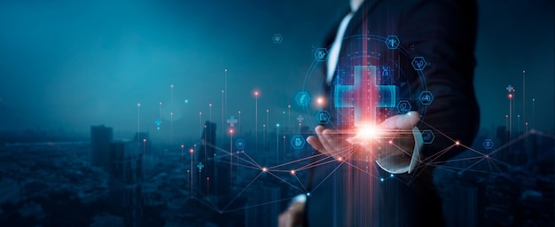 Businessman hold virtual medical network connection icons People awareness and spread attention
