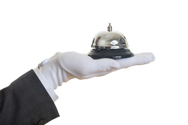 Campanello di servizio del maggiordomo in una mano guantata
