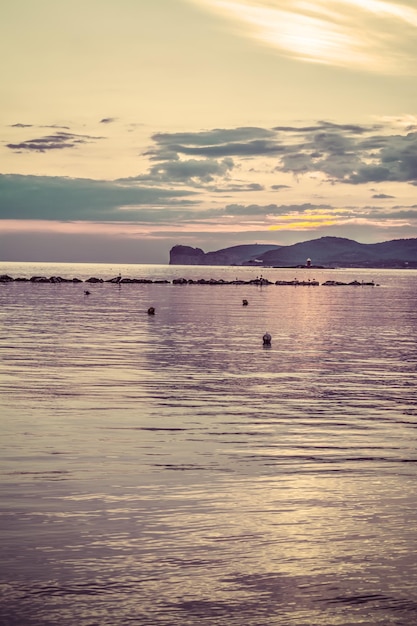 Capo Caccia sotto le nuvole al tramonto