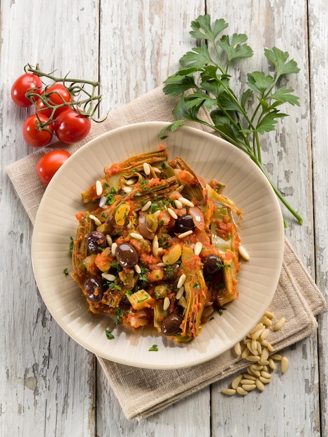 Caponata con atichoke e pinoli