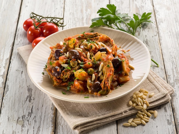 Caponata con atichoke e pinoli