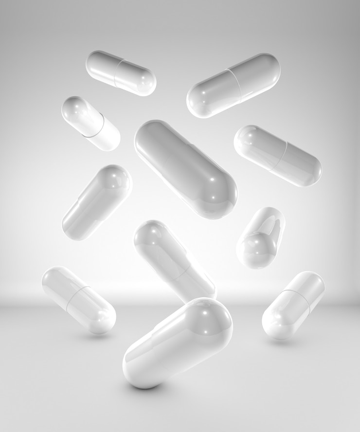 Capsule della medicina su fondo bianco