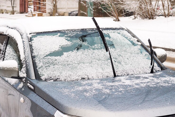 Car in snowdrift with sticking out so that they do not freeze