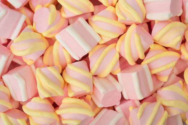 Caramelle di marshmallow rosa colorate per lo sfondo