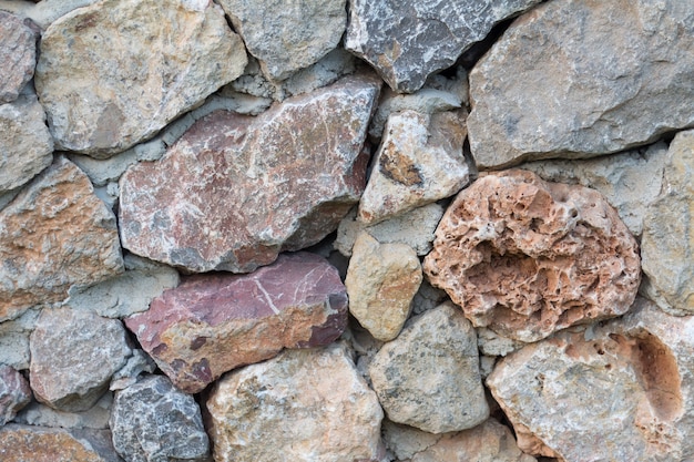 Carta da parati in pietra Pietra di superficie trama del muro di pietra. Muro di pietra per lo sfondo