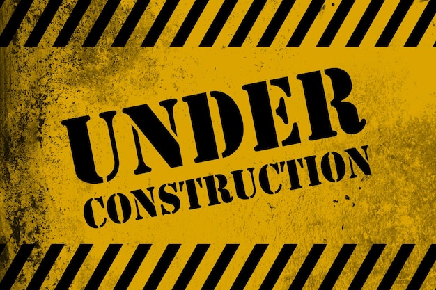Cartello in costruzione giallo con strisce