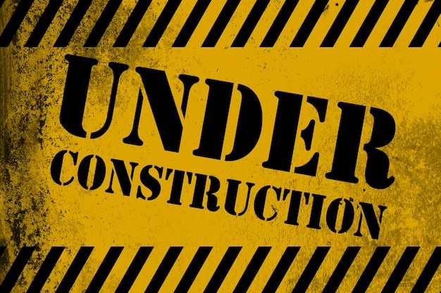 Cartello in costruzione giallo con strisce