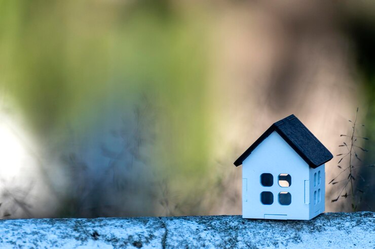 Foto casa bianca con tetto nero, per immobili, con spazio per inserire testo