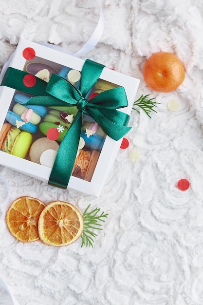 Casella di Natale di amaretti e mandarini Dolci vacanze presenti Sfondo regalo di Natale di Capodanno