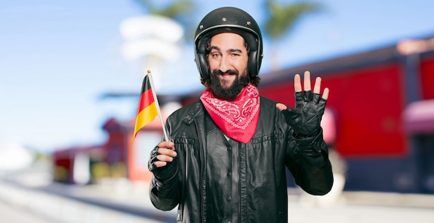 Cavaliere della moto con bandiera della Germania