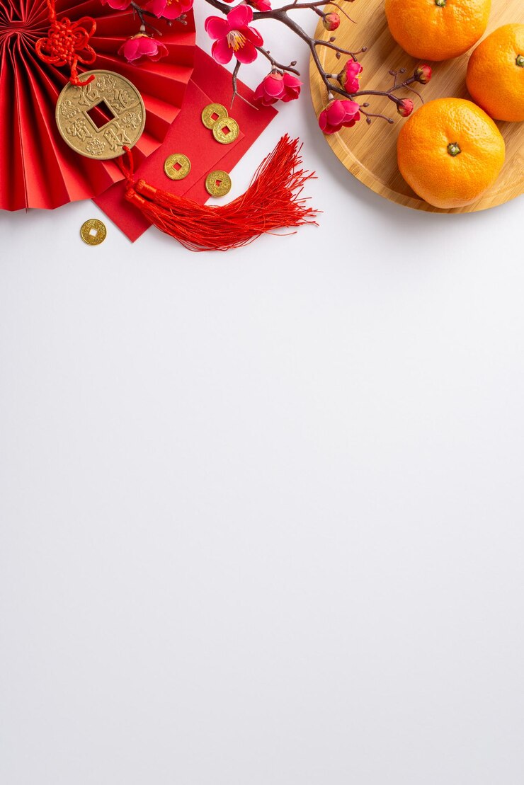 Photo celebrate chinese new years vibrancy through this top view vertical composition showcasing fan hong bao lucky coin charm wall hanging tangerines on white neutral background with sakura accents