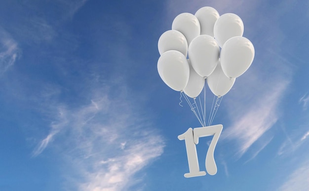 Celebrazione della festa numero 17 Numero allegato a un mazzo di palloncini bianchi contro il cielo blu