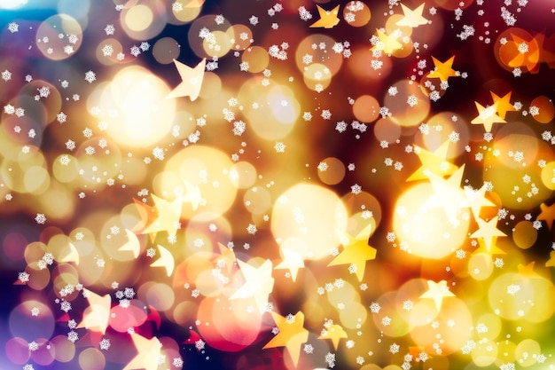 Celebrazione della luce astratta. Luci di colore incandescente natalizio con scintillii, bokeh astratto di Natale luminoso sfocato