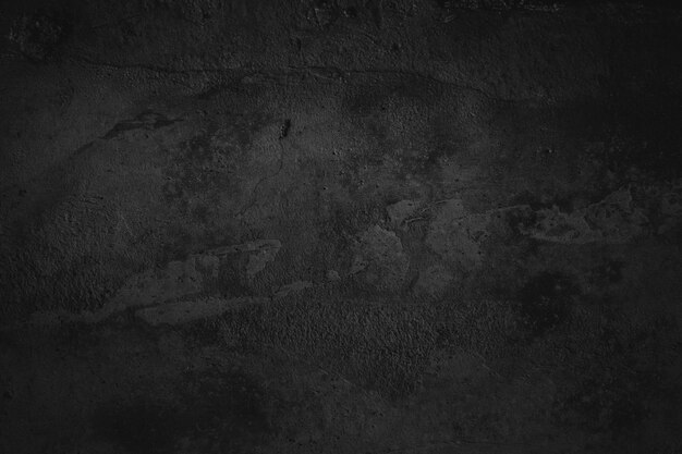 Cemento nero sullo sfondo della parete o texture di cemento di pietra come concetto di orrore e Halloween