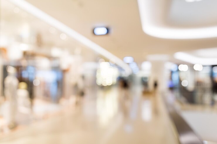 Foto centro commerciale astratto della sfuocatura e interno della vendita al dettaglio per fondo