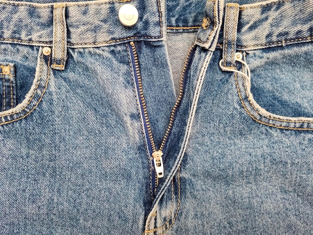 Cerniera sui jeans Tessuto jeans Closeup denim sfondo Jeans decompressi