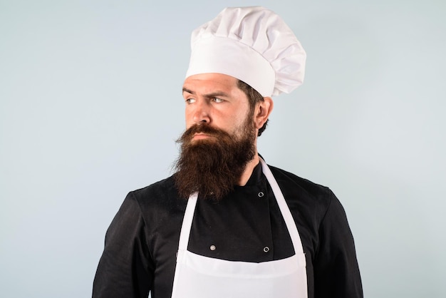 Chef maschio concetto di cibo chef barbuto in uniforme cappello e grembiule cuoco professionista o capo panettiere