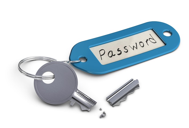 Chiave rotta con portachiavi in plastica con la parola password scritta a mano su di esso, su sfondo bianco.