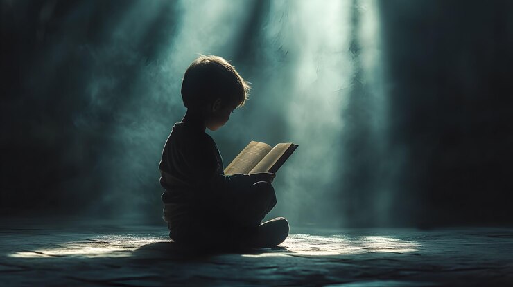 child reading a book in a quiet room with natural light