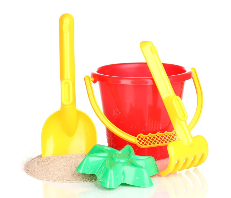 Photo childrens beach toys and sand isolated on white