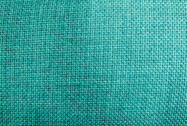 Chiuda su del fondo verde del modello di struttura del tessuto della tela da imballaggio o del sacco nel tono di colori pastelli.
