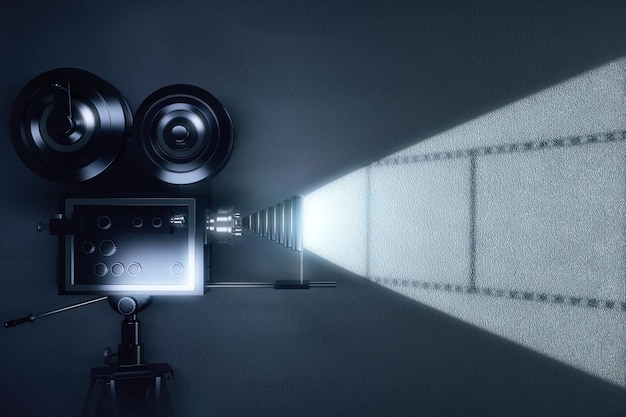 Cinepresa vintage con bobina di film sul muro grigio