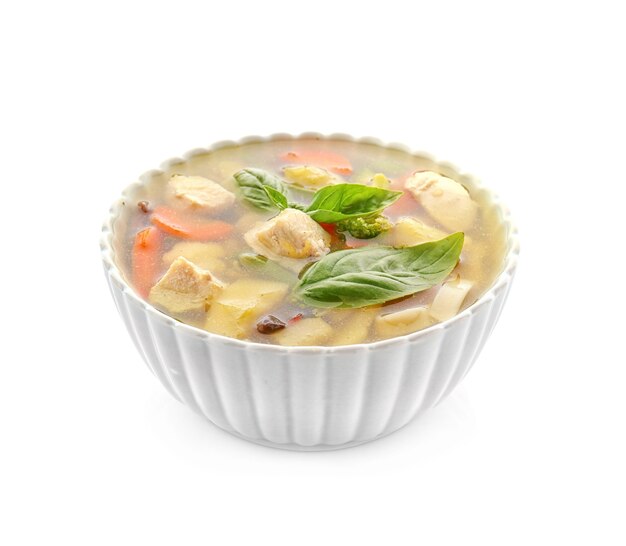 Ciotola con deliziosa zuppa di tacchino, isolata on white